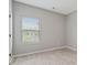 Bright bedroom with a large window offering natural light and wood-look flooring at 766 Chapman St, Jonesboro, GA 30238