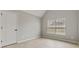 Bedroom with light gray walls, a window with blinds, and wood-look flooring at 766 Chapman St, Jonesboro, GA 30238