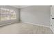 Bedroom featuring light gray walls, wood-look floors, and a window with blinds at 766 Chapman St, Jonesboro, GA 30238
