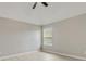 Bedroom featuring light gray walls, wood-look floors, and a window with blinds at 766 Chapman St, Jonesboro, GA 30238