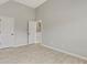 Bedroom featuring light gray walls, wood-look floors, and a white door at 766 Chapman St, Jonesboro, GA 30238