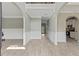 Light filled foyer with gray walls, white trim, arches, and wood-look floors at 766 Chapman St, Jonesboro, GA 30238