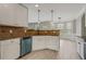 Open kitchen with white cabinets, dark countertops, and stainless-steel appliances at 766 Chapman St, Jonesboro, GA 30238