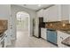 Bright kitchen with stainless steel appliances, granite countertops, and an adjacent dining area at 766 Chapman St, Jonesboro, GA 30238