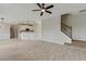 Open floor plan showcasing the kitchen, living area, and staircase with iron balusters at 766 Chapman St, Jonesboro, GA 30238