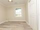 Bedroom featuring stylish wood-look flooring, neutral paint, and natural light at 935 Conley Se Rd, Atlanta, GA 30354