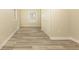 Bedroom featuring stylish wood-look flooring, neutral paint, and natural light at 935 Conley Se Rd, Atlanta, GA 30354