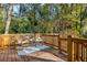 Outdoor living space showcasing the back deck with rocking chairs and wooded view at 954 Bouldercrest Se Dr, Atlanta, GA 30316