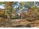 Backyard view with wooden fence, shed, and deck at 954 Bouldercrest Se Dr, Atlanta, GA 30316