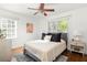 Bright bedroom with hardwood floors, ceiling fan, and large windows at 954 Bouldercrest Se Dr, Atlanta, GA 30316