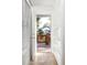 Hallway leading to outdoor deck with natural light, tile floors, built in shelves, and a warm, inviting atmosphere at 954 Bouldercrest Se Dr, Atlanta, GA 30316