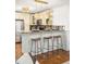 Well-lit kitchen featuring granite countertops, pendant lighting and stainless steel appliances and breakfast bar at 954 Bouldercrest Se Dr, Atlanta, GA 30316