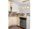Renovated kitchen featuring granite countertops, stainless steel appliances, and custom tile backsplash and cabinetry at 954 Bouldercrest Se Dr, Atlanta, GA 30316