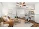 Bright living room with hardwood floors, wainscoting and ample space for entertaining near the kitchen at 954 Bouldercrest Se Dr, Atlanta, GA 30316
