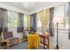 Sunlit office space with large windows, designer curtains, cozy seating, and functional workspace at 954 Bouldercrest Se Dr, Atlanta, GA 30316