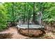 Backyard featuring trampoline, trees, and a wood fence at 148 Sierra Cir, Woodstock, GA 30188