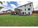 Exterior home view of spacious lawn, deck, screened porch, and patio at 148 Sierra Cir, Woodstock, GA 30188