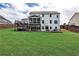 Large backyard with lush lawn and screened-in porch at 148 Sierra Cir, Woodstock, GA 30188