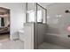 Modern bathroom featuring a glass-enclosed shower and a separate soaking tub at 148 Sierra Cir, Woodstock, GA 30188