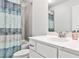 Bathroom featuring a shower/tub combo with modern curtain, and single sink vanity at 148 Sierra Cir, Woodstock, GA 30188
