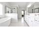 Bright bathroom with a soaking tub, tiled shower, double vanity and plenty of natural light at 148 Sierra Cir, Woodstock, GA 30188