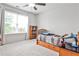 Bright bedroom featuring a window with natural light, bed and dresser at 148 Sierra Cir, Woodstock, GA 30188
