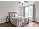 Cozy bedroom with a large window, neutral colors, and a comfortable bed at 148 Sierra Cir, Woodstock, GA 30188