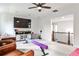 Bonus room with large television, gymnastic beam and seating area at 148 Sierra Cir, Woodstock, GA 30188