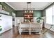 Dining room with an elegant chandelier, hardwood floors, and stylish decor at 148 Sierra Cir, Woodstock, GA 30188