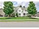 Beautiful two-story home featuring a well-manicured lawn and lush landscaping at 148 Sierra Cir, Woodstock, GA 30188