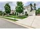 View of a two-story home with manicured lawn, long driveway and attached garage at 148 Sierra Cir, Woodstock, GA 30188
