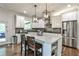 Modern kitchen with stainless steel appliances, gray subway tile backsplash, and a center island at 148 Sierra Cir, Woodstock, GA 30188