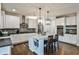 Stylish kitchen with white cabinets, stainless steel appliances, and a marble countertop island at 148 Sierra Cir, Woodstock, GA 30188