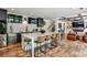 Stylish kitchen with a large island, barstool seating, stainless steel appliances, and hardwood floors at 148 Sierra Cir, Woodstock, GA 30188
