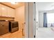 Well-equipped laundry room features a washer, dryer, utility sink and ample cabinet space at 148 Sierra Cir, Woodstock, GA 30188