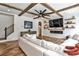 Beautiful living room with coffered ceilings, a fireplace, a large screen TV, and hardwood floors at 148 Sierra Cir, Woodstock, GA 30188