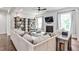 Bright and open living room with a fireplace, built in shelves, and hardwood floors at 148 Sierra Cir, Woodstock, GA 30188