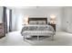 Comfortable main bedroom with natural light, neutral colors and a wooden bed frame at 148 Sierra Cir, Woodstock, GA 30188