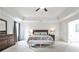 Spacious main bedroom featuring tray ceilings, neutral colors and an ensuite bathroom at 148 Sierra Cir, Woodstock, GA 30188