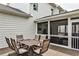 Back patio with an outdoor dining set, perfect for entertaining and enjoying the fresh air at 148 Sierra Cir, Woodstock, GA 30188