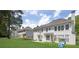 Features of the home's exterior and spacious lawn, enhanced by a patio and play equipment in the backyard at 250 Lawrence Pl, Atlanta, GA 30349