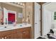 Bright bathroom featuring a double vanity, a large mirror, and modern fixtures at 250 Lawrence Pl, Atlanta, GA 30349