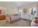 Charming bedroom with a pink daybed, white vanity, and princess-themed decor; perfect for a young  at 250 Lawrence Pl, Atlanta, GA 30349
