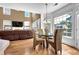 Bright and airy dining area features large windows and an adjacent living room with a fireplace at 250 Lawrence Pl, Atlanta, GA 30349