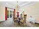 Elegant dining room with trey ceiling and access to both the foyer and kitchen at 250 Lawrence Pl, Atlanta, GA 30349