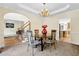 Formal dining area with tray ceiling, access to foyer, stairs, and open view of the kitchen at 250 Lawrence Pl, Atlanta, GA 30349