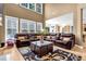 Bright living room with soaring ceilings, a fireplace, and an open layout that flows into the dining area at 250 Lawrence Pl, Atlanta, GA 30349