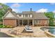 Luxurious backyard with pool, tanning deck, covered porch, and well manicured landscaping at 325 Edwards Brook Ln, Canton, GA 30115