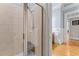Tiled shower with glass door, bench seating, and mounted shower head at 325 Edwards Brook Ln, Canton, GA 30115