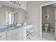 Bathroom with white cabinets, a large mirror, and a marble countertop at 325 Edwards Brook Ln, Canton, GA 30115